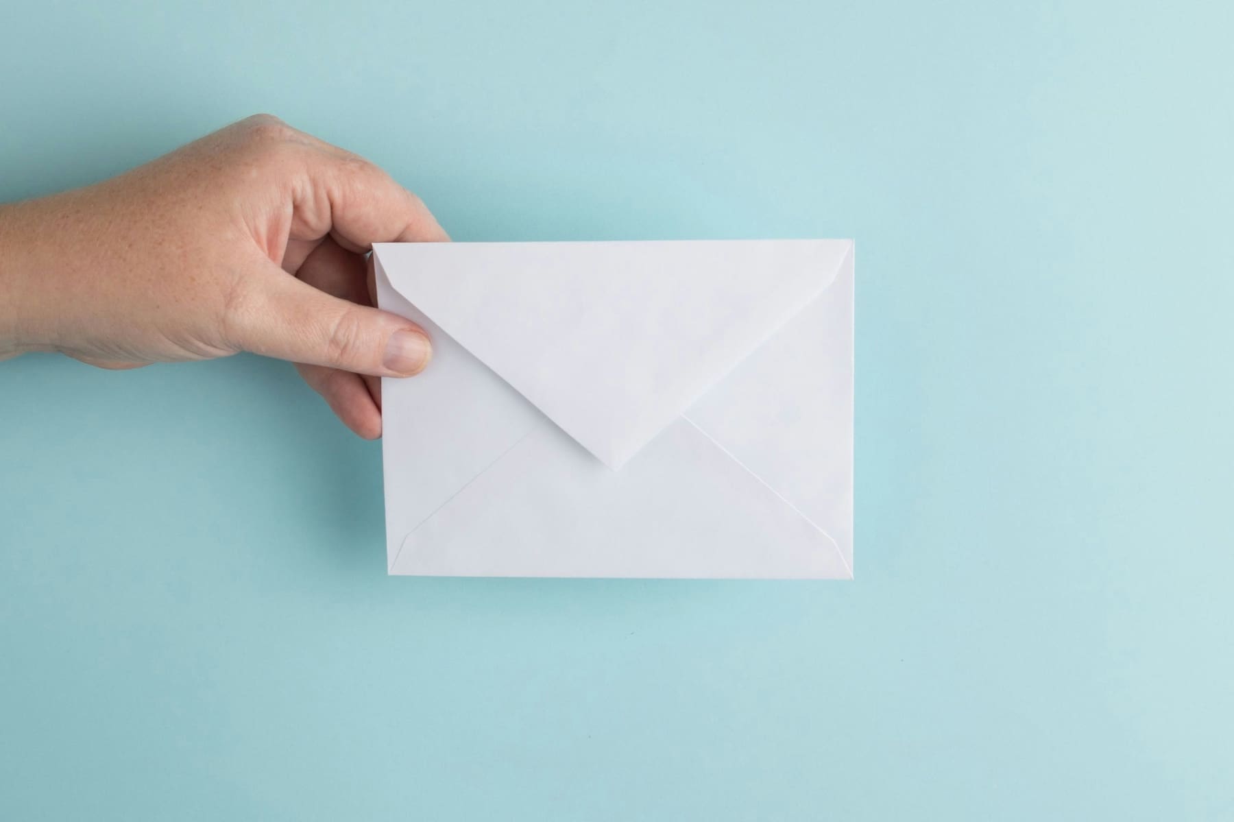 hand holding envelope